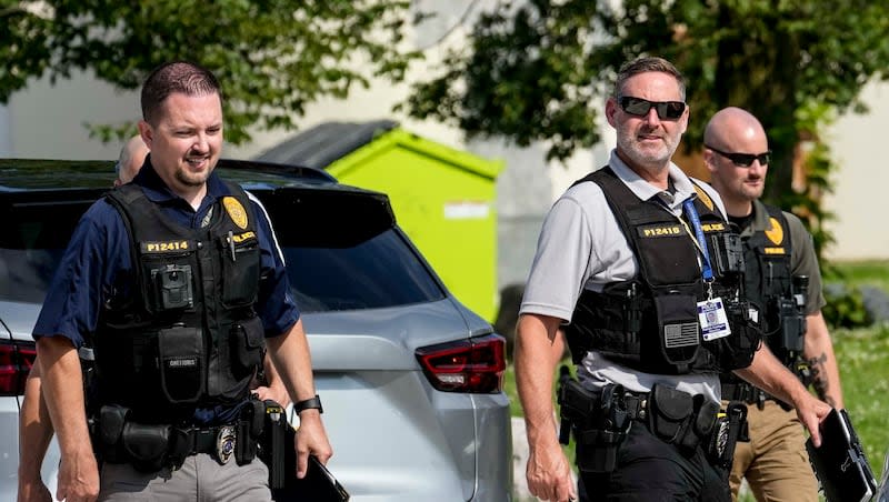 Police investigators leave the scene where one person was shot and killed by police during the second day of the 2024 Republican National Convention,Tuesday, July 16, 2024, in Milwaukee. The shooting occurred outside of the security perimeter for the Republican National Convention.