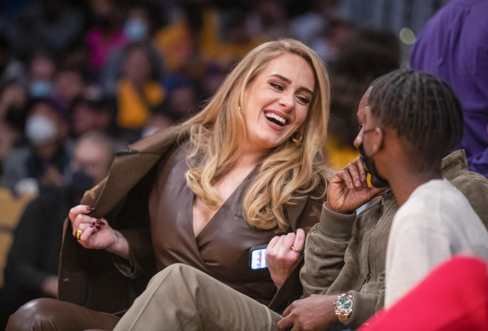 <p>The British songstress and <a href="https://people.com/music/adele-and-boyfriend-rich-paul-all-smiles-for-date-night-at-nba-season-opener/" rel="nofollow noopener" target="_blank" data-ylk="slk:boyfriend Rich Paul;elm:context_link;itc:0;sec:content-canvas" class="link ">boyfriend Rich Paul</a> (face obscured here) were all smiles for date night sitting courtside at Staples Center.</p>