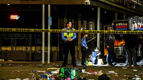 PHOTO: Police officers collect evidence at the scene of a shooting that occured during the Krewe of Bacchus parade in New Orleans, Feb. 19, 2023. (Chandan Khanna/AFP via Getty Images)