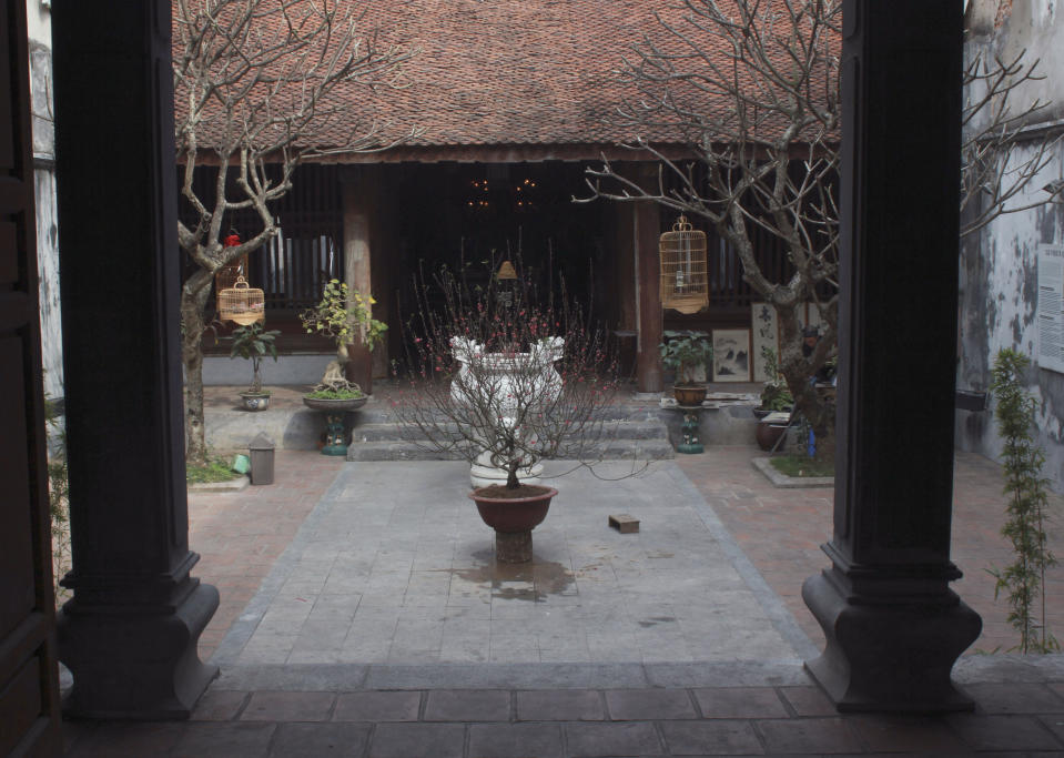 This Jan. 24, 2014 photo, shows Kim Ngan Temple, a historic property in the Old Quarter of Hanoi, Vietnam. It was recently restored by city authorities with assistance from architectural consultants from the French city of Toulouse. Romain Orfeuvre, an architect from that city who works in Hanoi, said the Old Quarter resisted change decades ago because of stunted economic development during Vietnam's wars against France and the United States, and more recently because authorities have been reluctant to evict squatters. (AP Photo/Mike Ives)