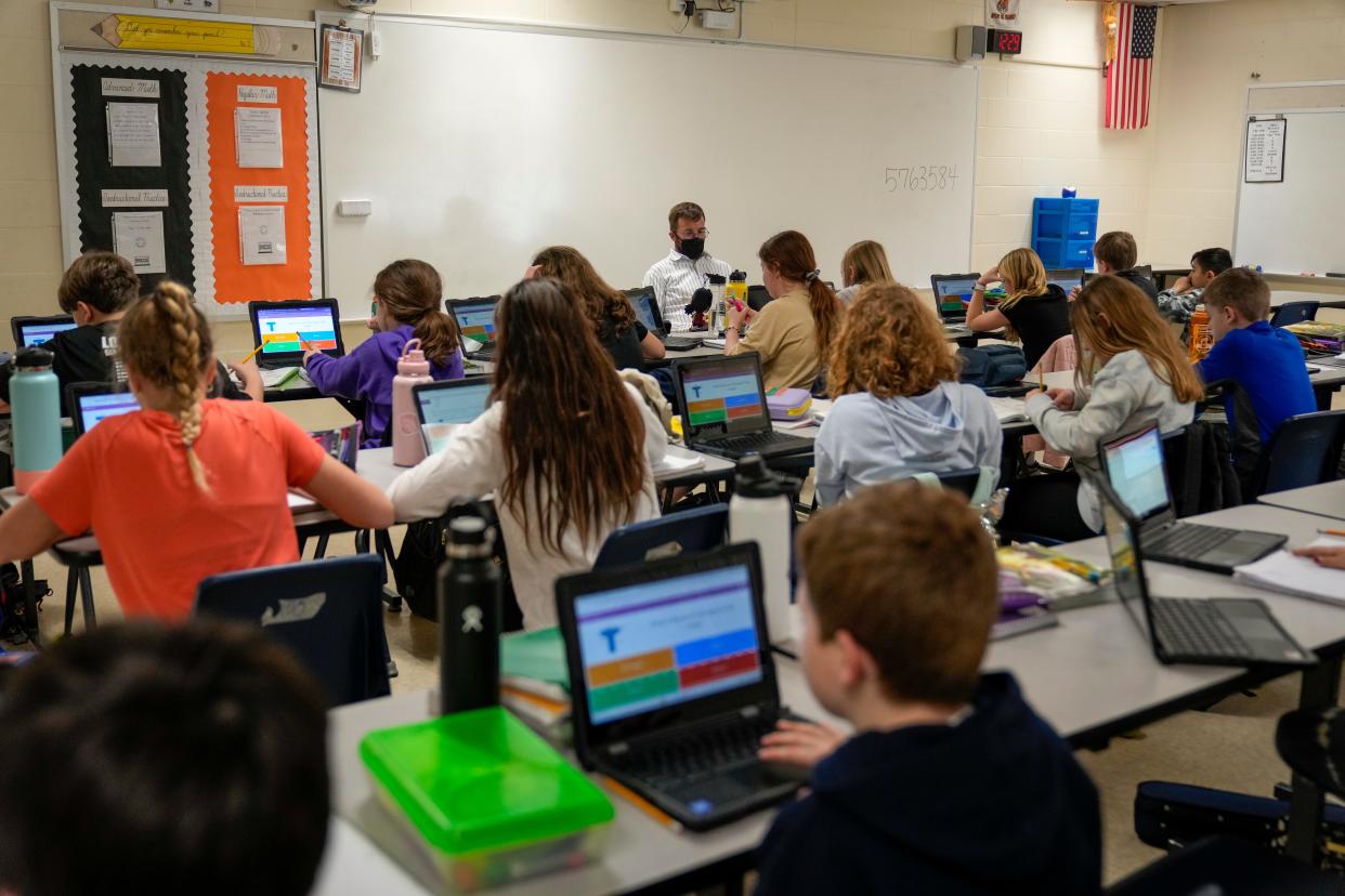 Students work from Chromebooks in a packed classroom at the Loveland Intermediate and Middle School. Loveland City Schools resume classes on Aug. 16 and 17.