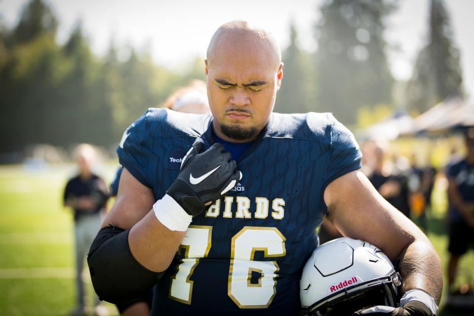 Giovanni Manu takes a moment during a game between the University of British Columbia Thunderbirds and the University of Manitoba Bisons at Thunderbird Stadium in Vancouver, B.C.