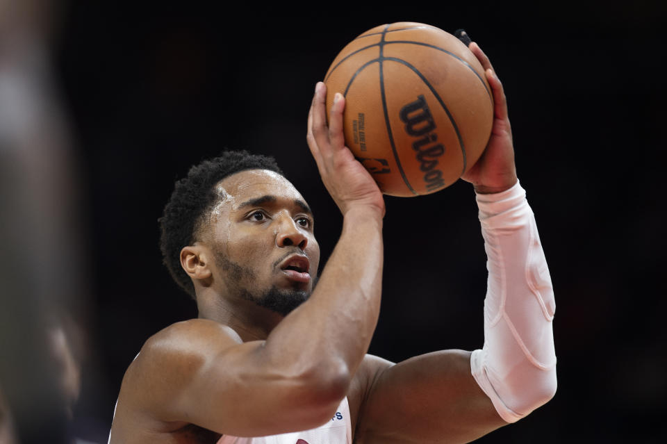 Cleveland Cavaliers guard Donovan Mitchell shoots a foul shot during the second half of an NBA basketball game against the Atlanta Hawks, Tuesday, March 28, 2023, in Atlanta. (AP Photo/Hakim Wright Sr.)