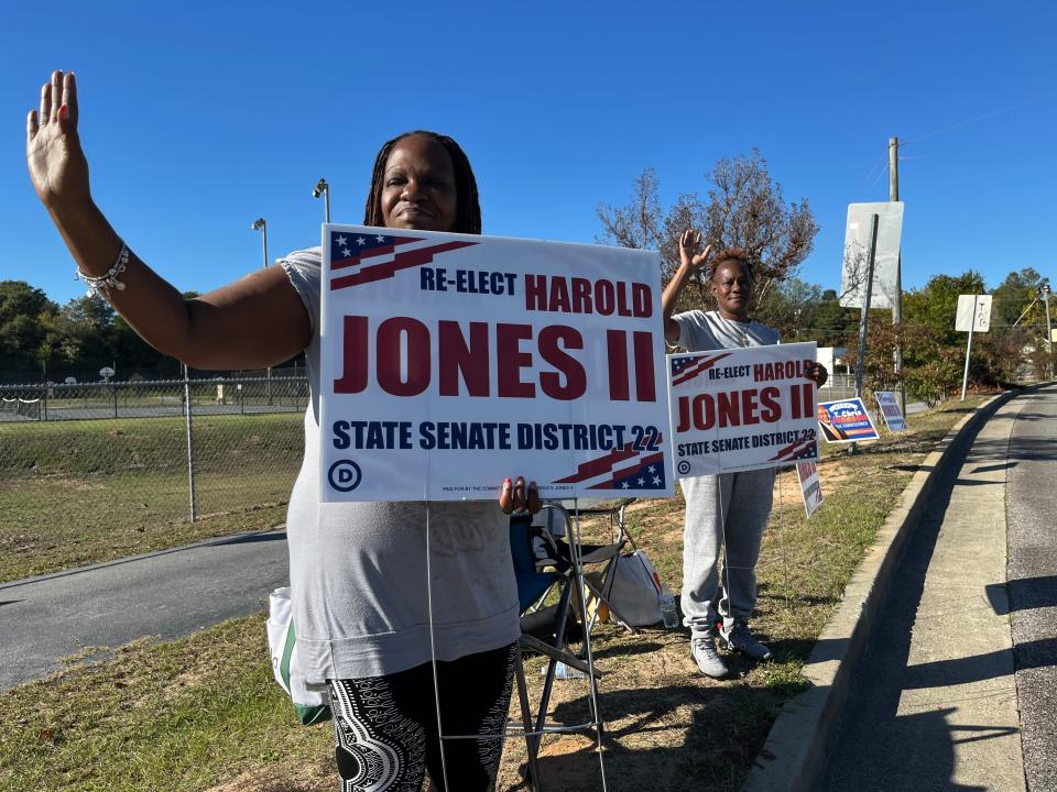 Lynda Fryer, left, and her sister Roberta Fryer, right, campaign for state Sen. Harold Jones II outside the Henry Brigham Community Center on Golden Camp Road in Augusta, Georgia, during the midterm Election Day on Tuesday, Nov. 8 2022.