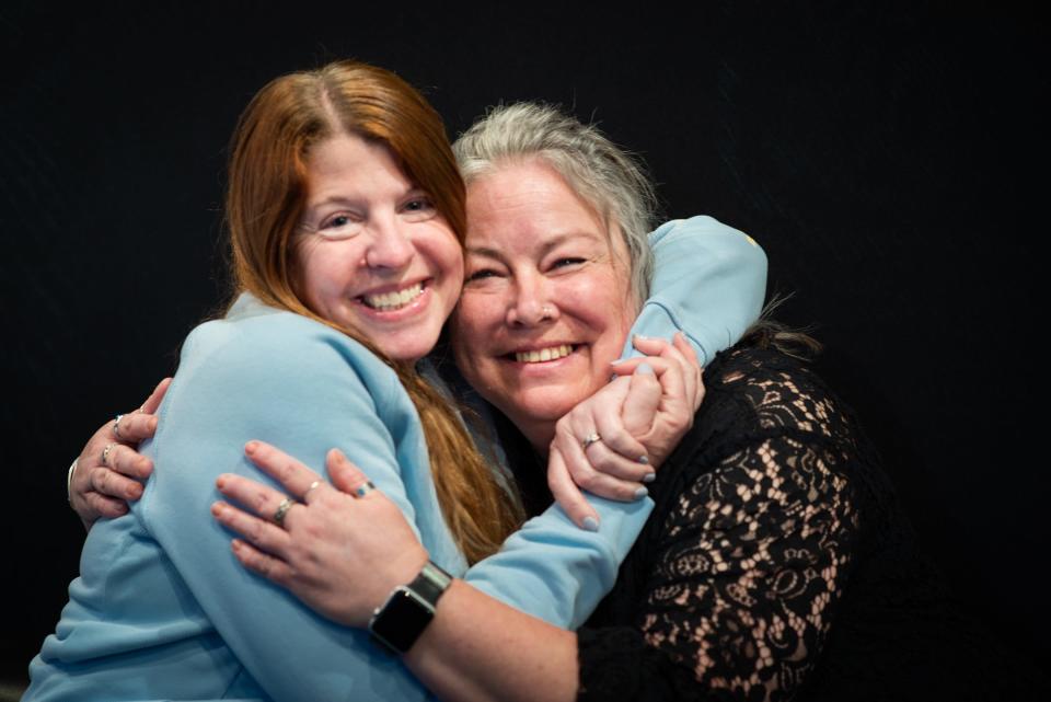 Stacy Balmes of Mason, right, pictured with retired Ingham County Sheriff Det. Amber Kenny-Hinojosa, Thursday, March 14, 2024, at the salon here they first met in 2021. Kenny-Hinojosa interceded in Balmes' situation and days later Balmes' husband was arrested and charged with aggravated stalking. "She didn't know a thing about me, and in that one appointment she changed our lives," Balmes says.