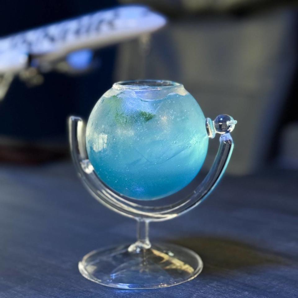 Many of the cocktails at Flight 1868 come in glasses with fun shapes, like this globe. There’s also a milk carton, a diamond and a bird cage. Courtesy photo