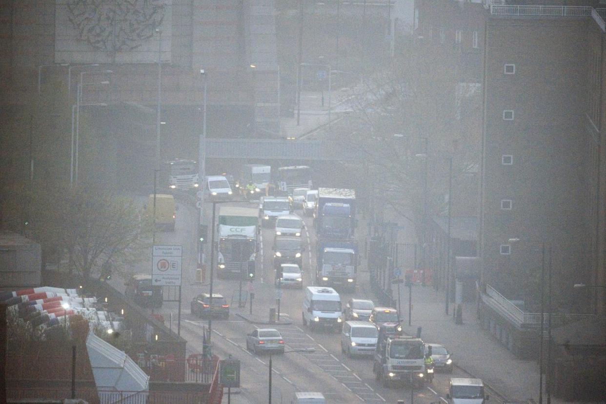 Deadly air: Smog hangs over a London street: Jeremy Selwyn