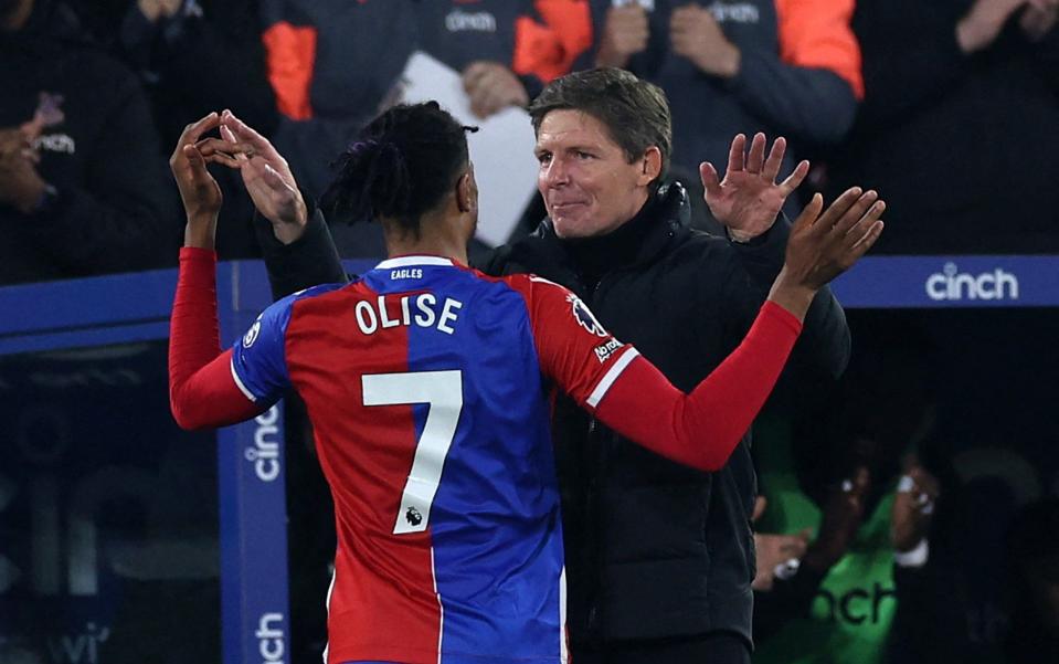 Crystal Palace's French midfielder #07 Michael Olise (L) celebrates with Crystal Palace's Austrian manager Oliver Glasner
