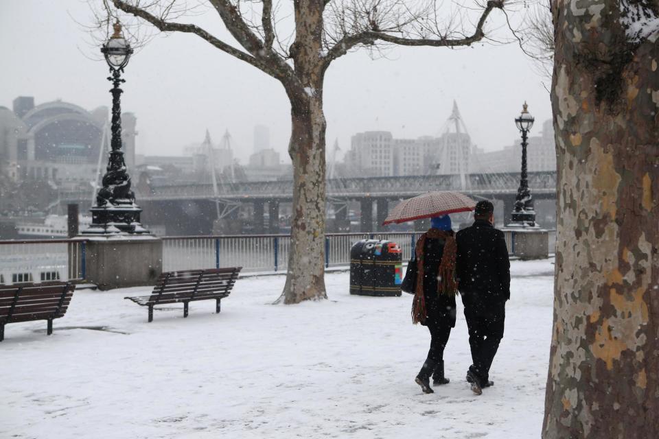 <p>A file picture of snow falling in London in January, 2013</p> (Getty Images)