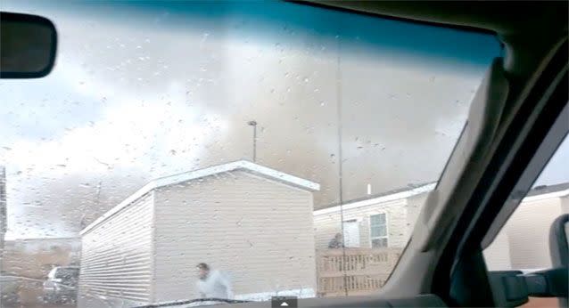 A tornado rips through a North Dakota trailer park as two men watch from inside their truck. Source: Dan Yorgason/Youtube