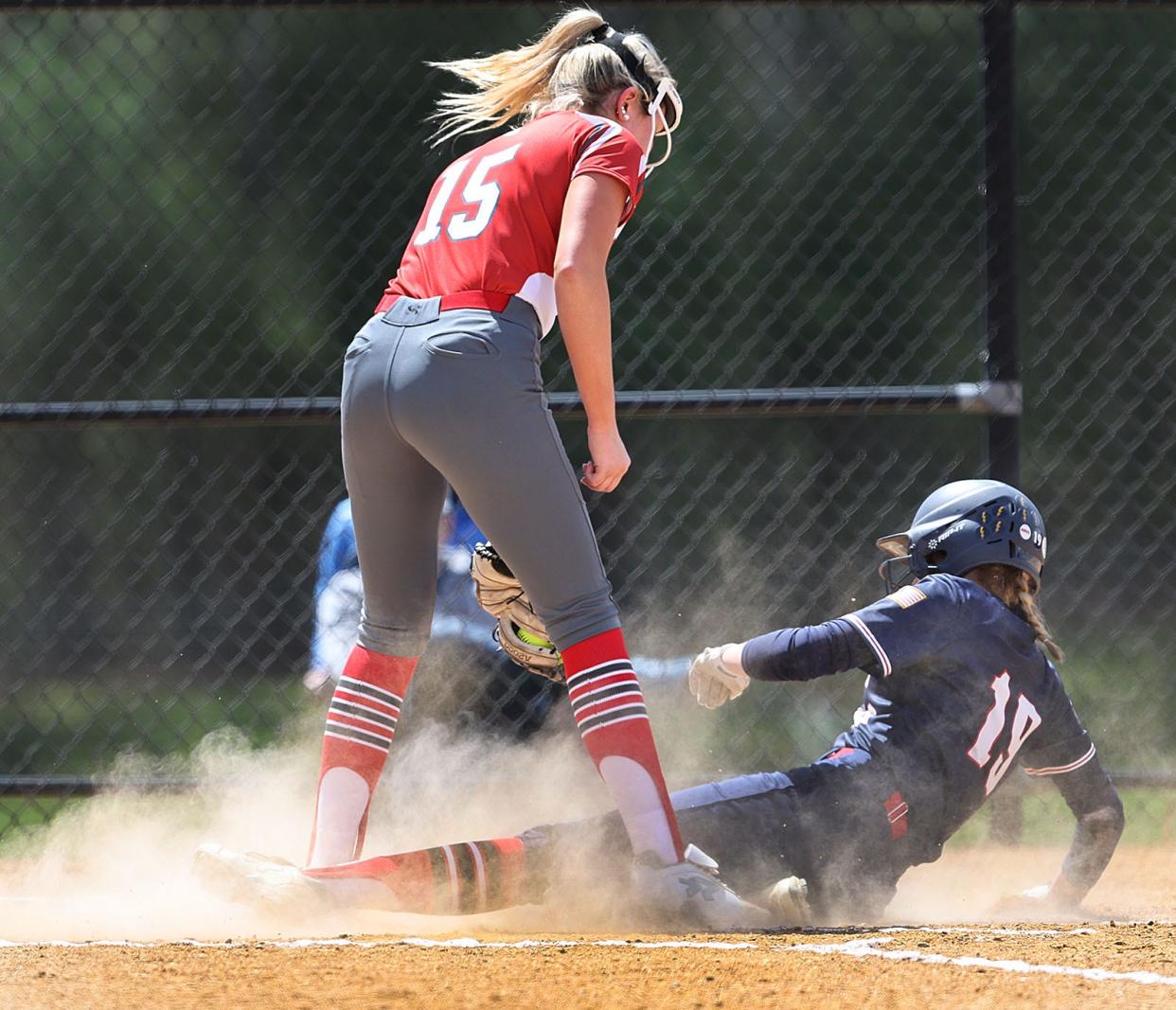 Lakers pitcher misses a tag on Warrior Sarah Danielson at home plate.

Silver Lake softballs hosts Lincoln Sudbury on Wednesday April 17, 2024