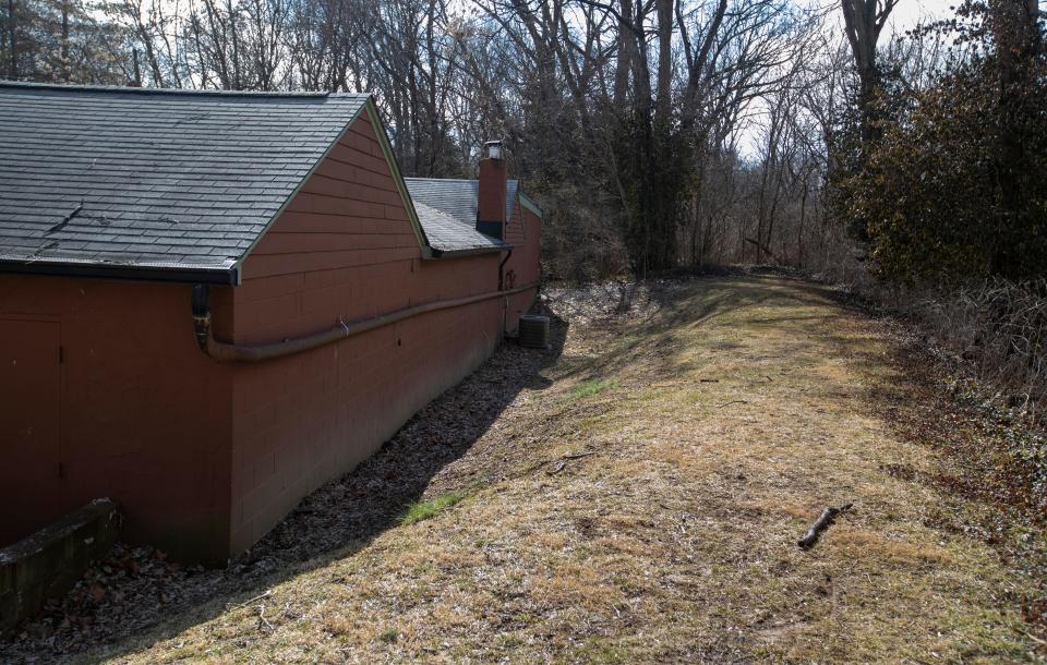 An existing levee near the town hall in the Rocky Ripple neighborhood, Indianapolis, Tuesday, March 1, 2022, amid a current plan by the city to demolish 14 homes to make way for a new proposed levee along the White River. 