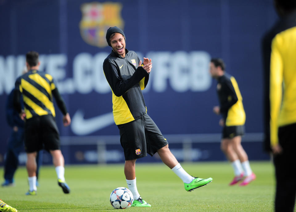 FC Barcelona's Neymar, from Brazil, smiles during a training session at the Sports Center FC Barcelona Joan Gamper in San Joan Despi, Spain, Tuesday, March 11, 2014. FC Barcelona will play against Manchester City in a group H Champions League on Wednesday March 12. (AP Photo/Manu Fernandez)