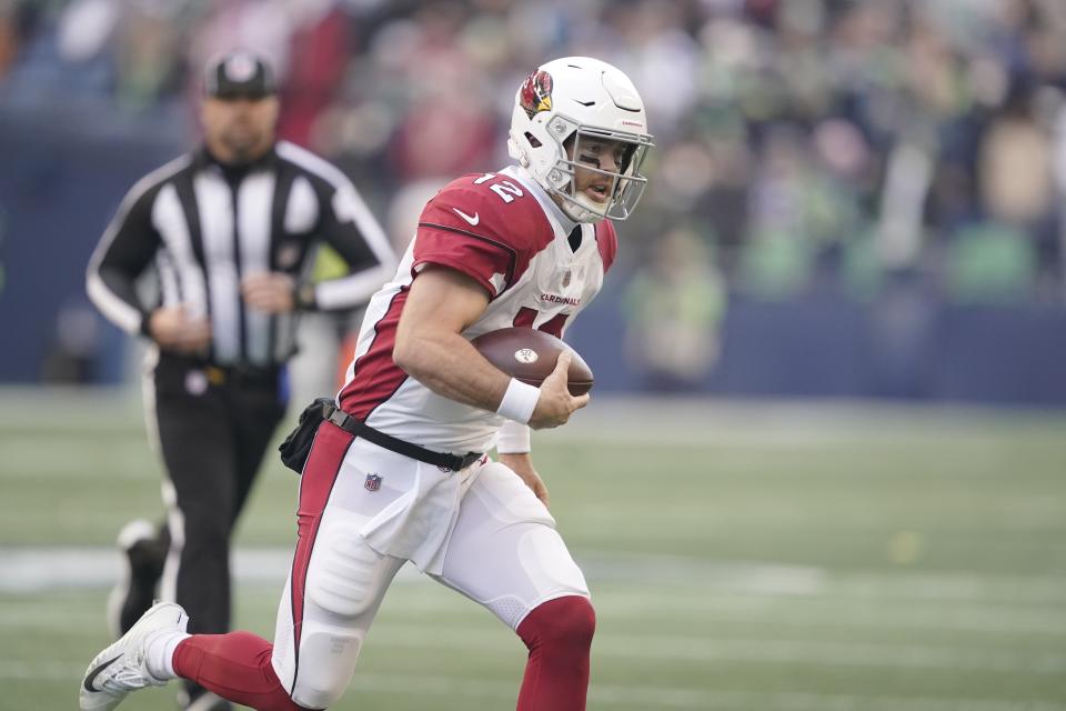 Arizona Cardinals Colt McCoy scrambles against the Seattle Seahawks during the first half of an NFL football game, Sunday, Nov. 21, 2021, in Seattle. (AP Photo/Ted S. Warren)