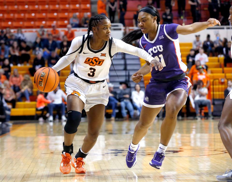 OSU's Naomie Alnatas (3) drives to the basket against TCU's Knisha Godfrey (11) during the Cowgirls' 80-70 win Saturday at Gallagher-Iba Arena in Stillwater.