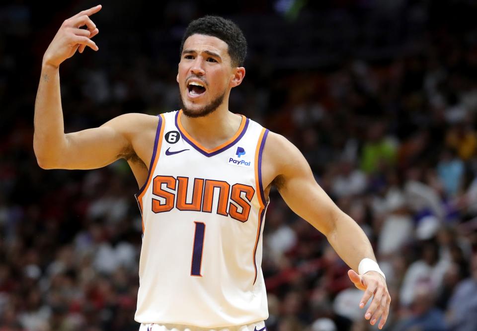 MIAMI, FLORIDA - NOVEMBER 14: Devin Booker #1 of the Phoenix Suns reacts during the second quarter against the Miami Heat at FTX Arena on November 14, 2022 in Miami, Florida. NOTE TO USER: User expressly acknowledges and agrees that, by downloading and or using this photograph, User is consenting to the terms and conditions of the Getty Images License Agreement. (Photo by Megan Briggs/Getty Images)