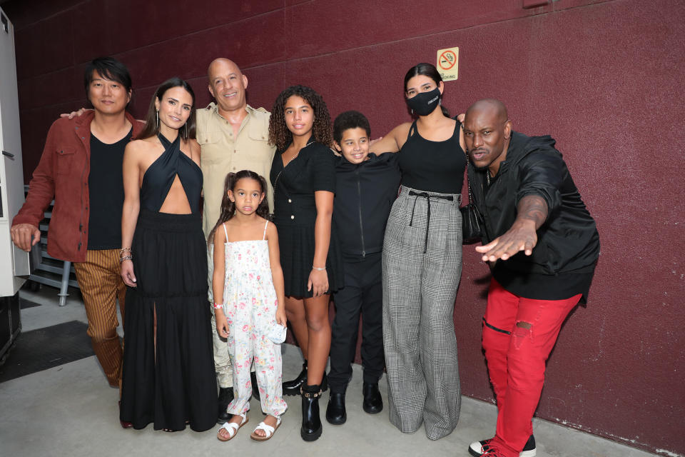 Diesel's co-stars, Sung Kang, Jordana Brewster and Tyrese Gibson, take a photo with his real-life family.
 (Alex J. Berliner / ABImages via AP)