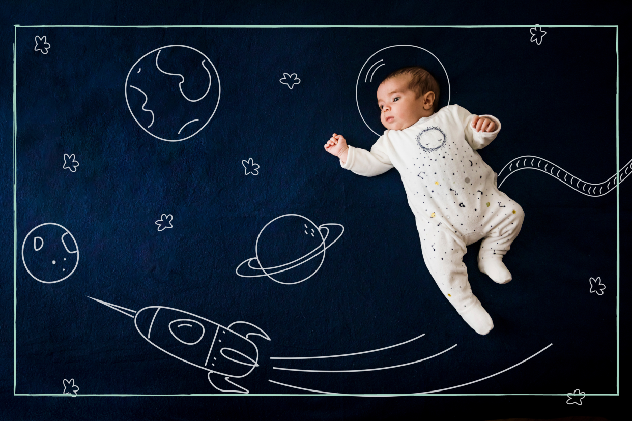  Baby on space-inspired background. 