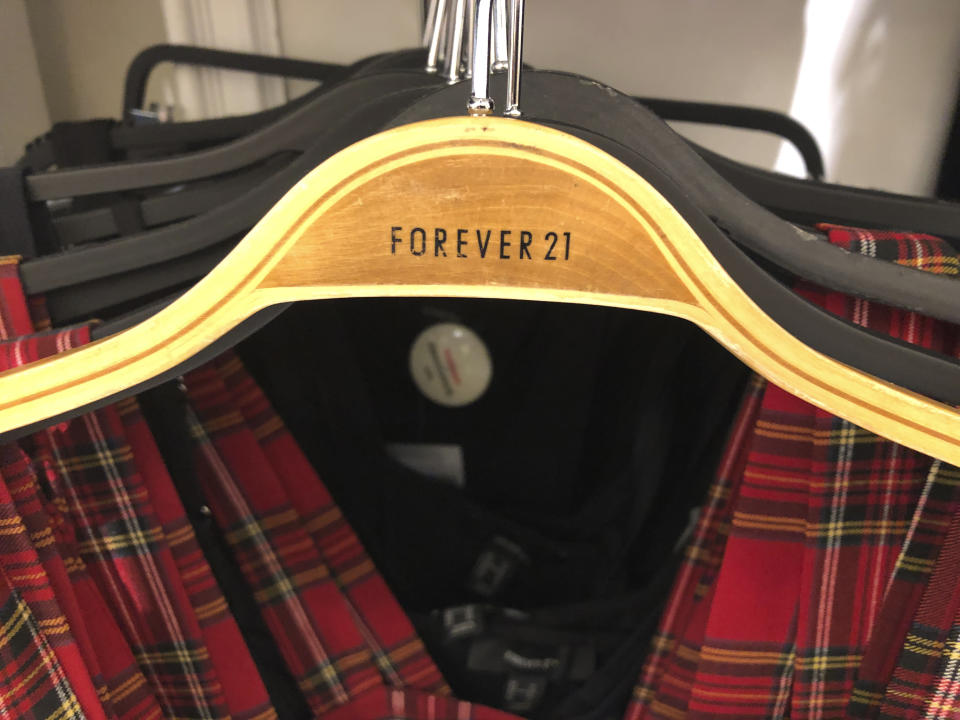 Clothing at a Forever 21 store are shown, Monday, Sept. 30, 2019, in Aventura, Fla. The low-price fashion chain, a one-time hot destination for teen shoppers that fell victim to its own rapid expansion and changing consumer tastes, has filed for Chapter 11 bankruptcy protection. (AP Photo/Wilfredo Lee)