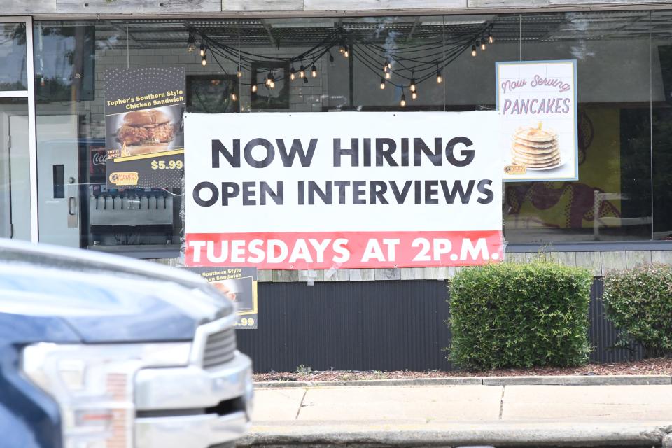 Restaurant signs along a narrow strip of Hardy Street in Hattiesburg, Miss., in May 2021 show there is a shortage of hospitality workers. The industry has flourished as COVID-19 restrictions have loosened but need staff to better serve their customers.