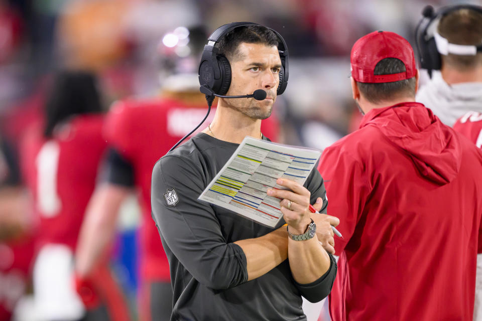 FILE - Tampa Bay Buccaneers offensive coordinator Dave Canales holds the play sheet on the sidelines during an NFL wild-card playoff football game against the Philadelphia Eagles, Monday, Jan. 15, 2024 in Tampa, Fla. The Carolina Panthers have agreed to hire Tampa Bay Buccaneers offensive coordinator Dave Canales as their new head coach, according to two people familiar with the situation. (AP Photo/Doug Murray, File)