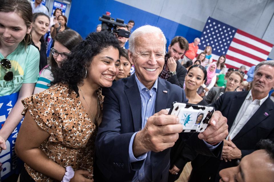 Supporters of former Vice President Joe Biden pose for cell phone photos with him following his town hall event at the Staunton Bridge Community Center Thursday, August 29, 2019.