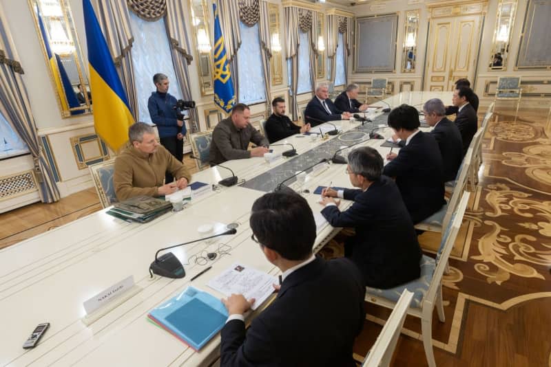 Ukrainian President Volodymyr Zelensky (3rd L) meets with Japanese Foreign Minister Takeshi Iwaya (3rd R) at the Mariinskyi Palace. -/Ukraine Presidency/dpa