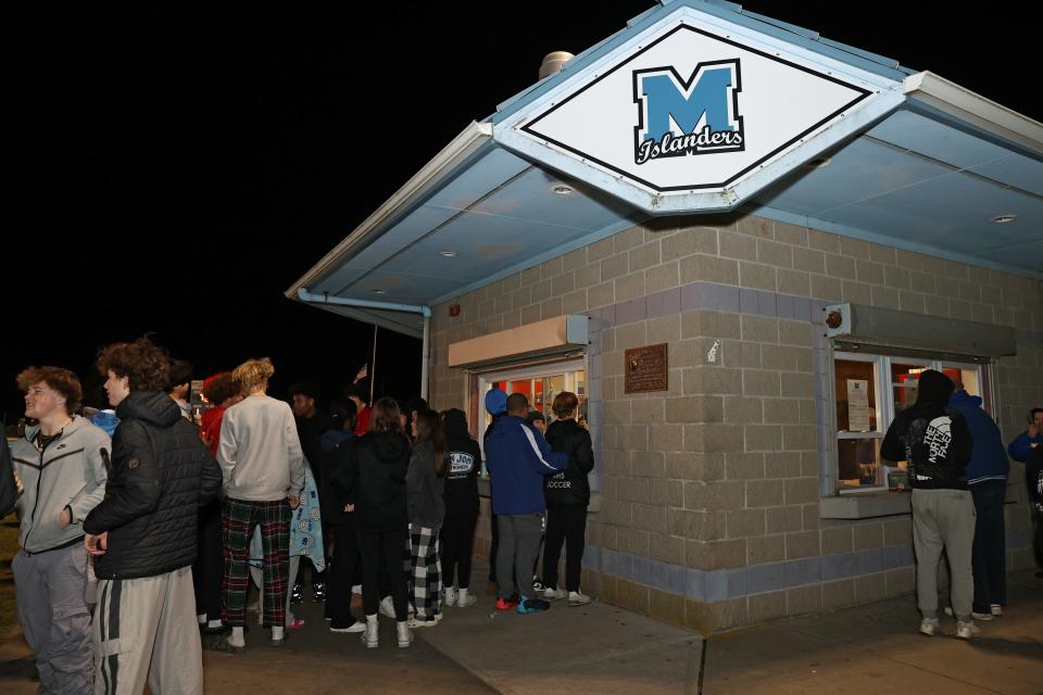 A line forms outside the Middletown concession stand during Friday night's first round playoff game against Moses Brown.