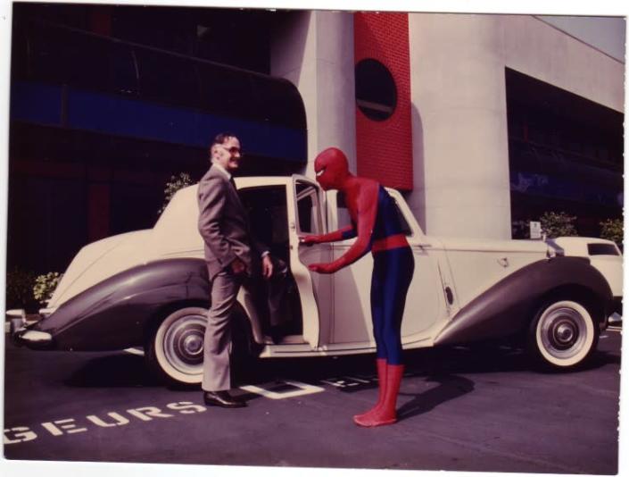 Spider-Man holds the door to for Stan Lee (left) to Lee&#39;s Rolls Royce at Marvel Productions in the early 1980s.