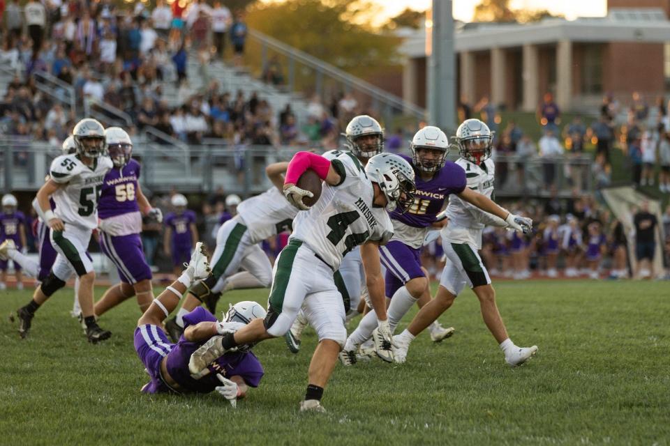 Joshua Thibodeau carries the ball as Warwick football hosts Minisink Valley on Monday, Oct. 2, 2023.