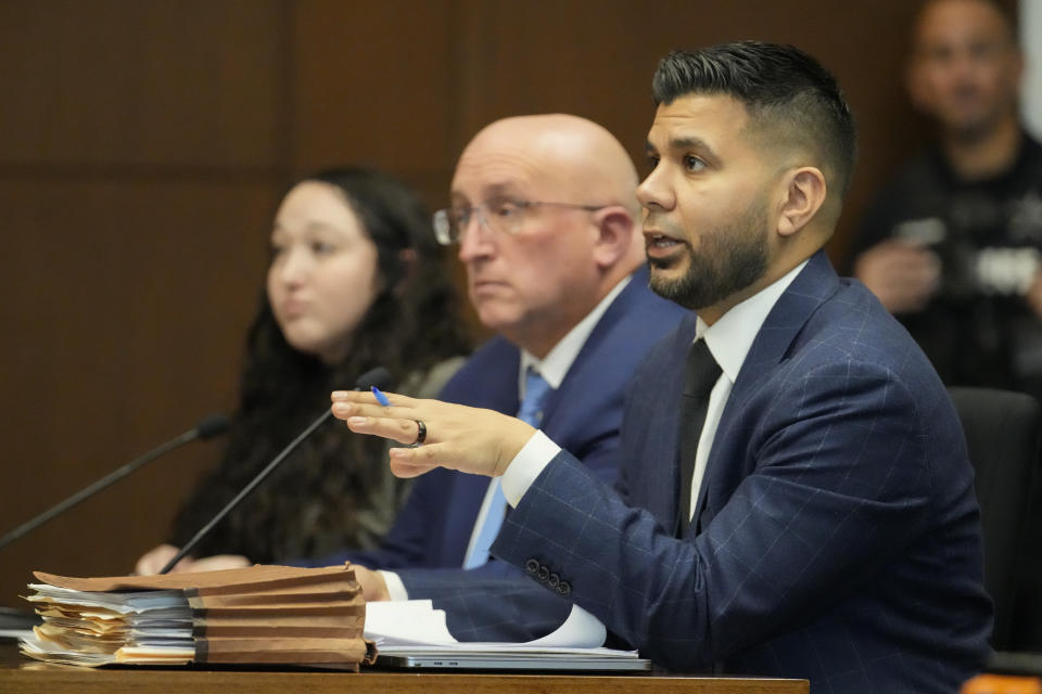 Attorney George Gomez, right, speaks as Robert E. Crimo Jr., appears before Judge George D. Strickland at the Lake County Courthouse, Monday, Nov. 6, 2023, in Waukegan, Ill. The father of a man charged with fatally shooting seven people at a Fourth of July parade in suburban Chicago is scheduled for a bench trial started Monday on charges that he helped his son obtain a gun license years before the attack. (AP Photo/Nam Y. Huh, Pool)