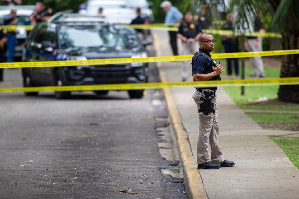 Officers with the Tallahassee Police Department work a crime scene in the Holton Street apartments complex where an officer involved shooting occurred late Wednesday morning, May 27, 2020. The person who was killed by police is believed to have stabbed and killed a man on Saxon Street.