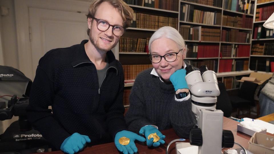 The inscription was deciphered by linguist Krister Vasshus (left) and runologist Lisbeth Imer (right) at the National Museum of Denmark. It is the earliest-known inscription that mentions Odin.