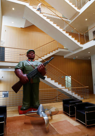 A statue by Chinese artist Zhang Jianhua is pictured in the headquarters of independent watchmaker Breitling in La Chaux-de-Fonds, Switzerland May 26, 2016. REUTERS/Denis Balibouse