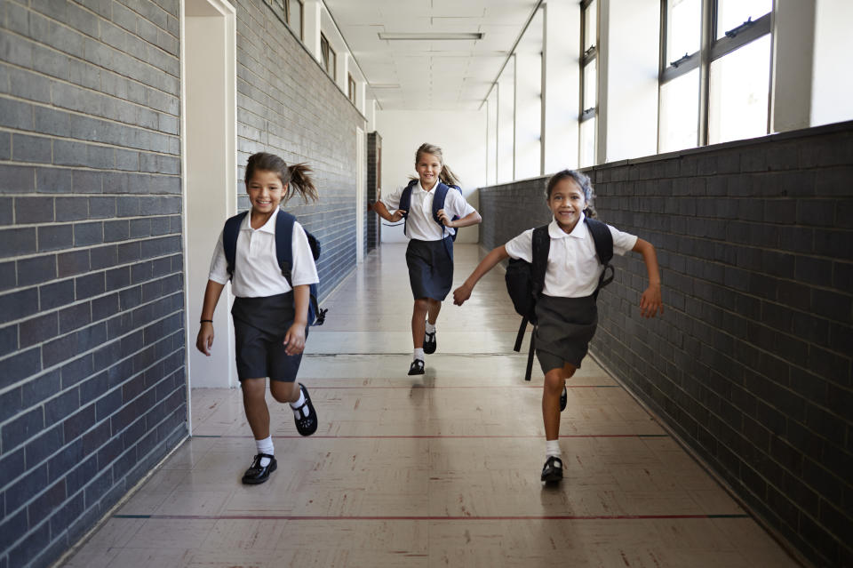 Schoolgirl running in the corridors