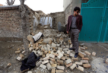A man stands near the debris at one of the explosion sites in Kabul, Afghanistan, March 21, 2019. REUTERS/Parwiz