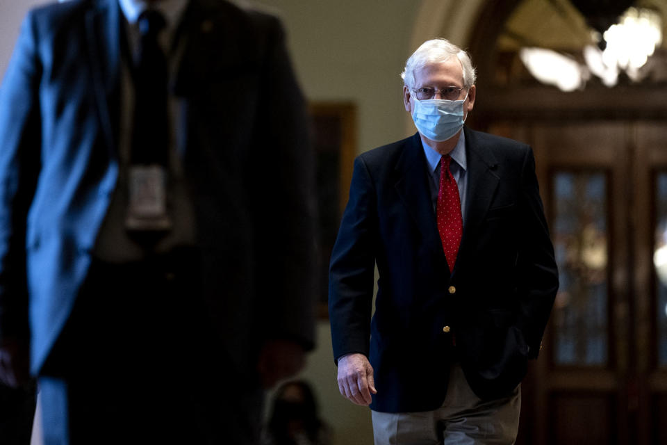 Mitch McConnell is seen wearing a mask. 