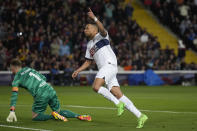 PSG's Kylian Mbappe celebrates after scoring his side's third goal during the Champions League quarterfinal second leg soccer match between Barcelona and Paris Saint-Germain at the Olimpic Lluis Companys stadium in Barcelona, Spain, Tuesday, April 16, 2024. (AP Photo/Emilio Morenatti)