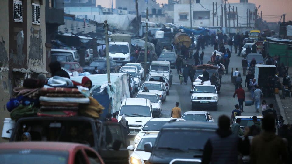 A view of a street, filled with cars, as Palestinians migrate towards Deir al-Balah city with few belonging, they could take with themselves, on a truck due to ongoing and intensified Israeli attacks on Rafah, in Deir al-Balah, Gaza on February 13, 2024. - Ashraf Amra/Anadolu/Getty Images