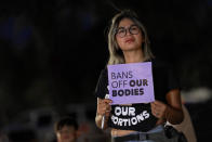 FILE - Celina Washburn protests outside the Arizona Capitol to voice her dissent with an abortion ruling, Friday, Sept. 23, 2022, in Phoenix. An Arizona judge ruled the state can enforce a near-total ban on abortions that has been blocked for nearly 50 years. The law was first enacted decades before Arizona became a state in 1912. (AP Photo/Matt York, File)