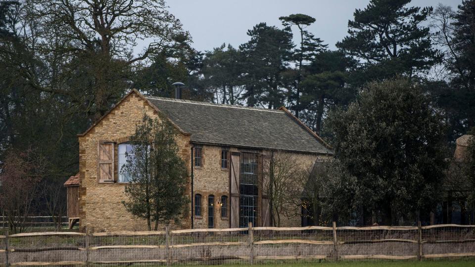 Large farmhouse in wooded area