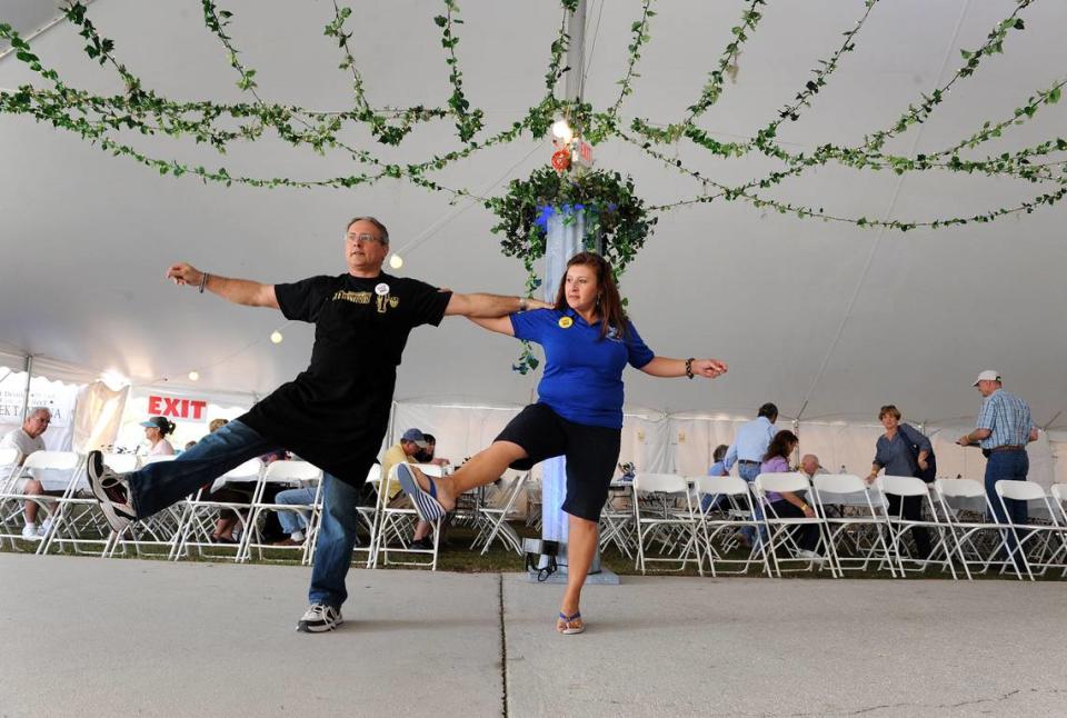 Stamatis Zeris and Samira Choueiri dance the hasapiko, or, the butcher’s dance, at the Greek Glendi held annually at St. Barbara’s Greek Orthodox Church. TIFFANY TOMPKINS-Bradenton Herald