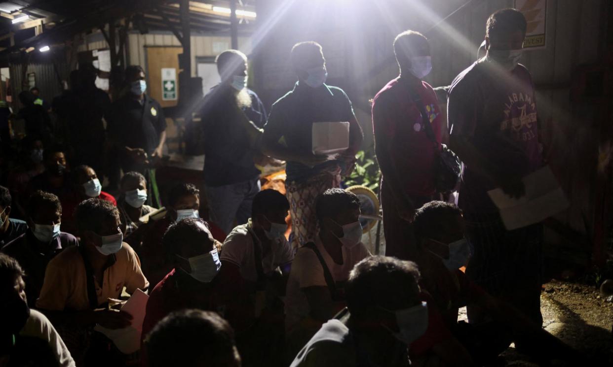 <span>Migrant workers have their documents checked in Kuala Lumpur as part of a crackdown on forced labour and human trafficking in Malaysia. </span><span>Photograph: Hasnoor Hussain/Reuters</span>