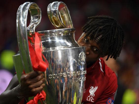 Divock Origi celebrates with the Champions League trophy (Getty Images)