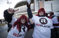 Ottawa Redblacks fans celebrate outside of the venue before the CFL's 103rd Grey Cup championship football game between the Redblacks and the Edmonton Eskimos in Winnipeg, Manitoba, November 29, 2015. REUTERS/Lyle Stafford