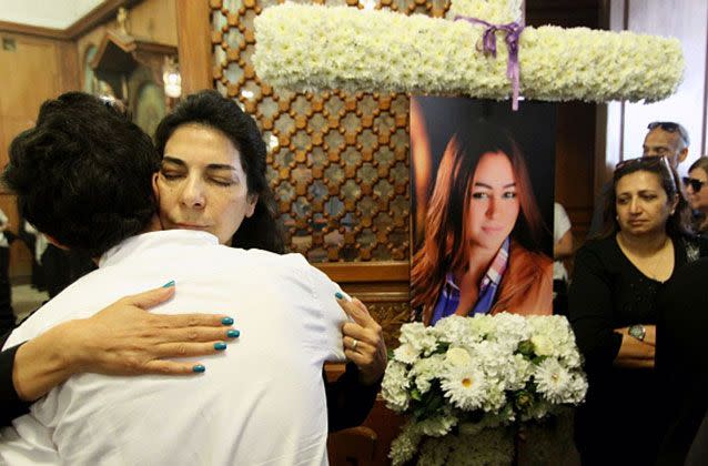 Relatives and friends of EgyptAir hostess Yara Hani (portrait), who was onboard Flight MS804. Photo: STR/AFP/Getty Images