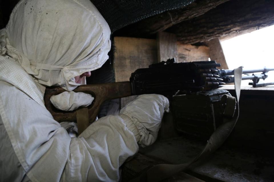 A serviceman takes his position in a trench at the line of separation near Yasne village, controlled by Russia-backed separatists, eastern Ukraine (Alexei Alexandrov/AP) (AP)