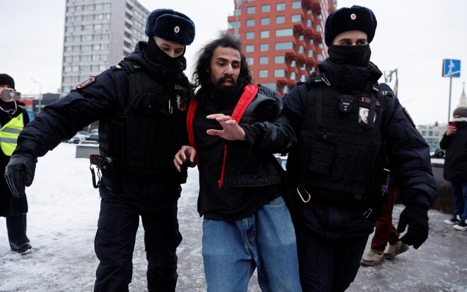 Police officers detain a man during a gathering in memory of Russian opposition leader Alexei Navalny near the Wall of Grief monument to the victims of political repressions in Moscow, Russia February 17, 2024.