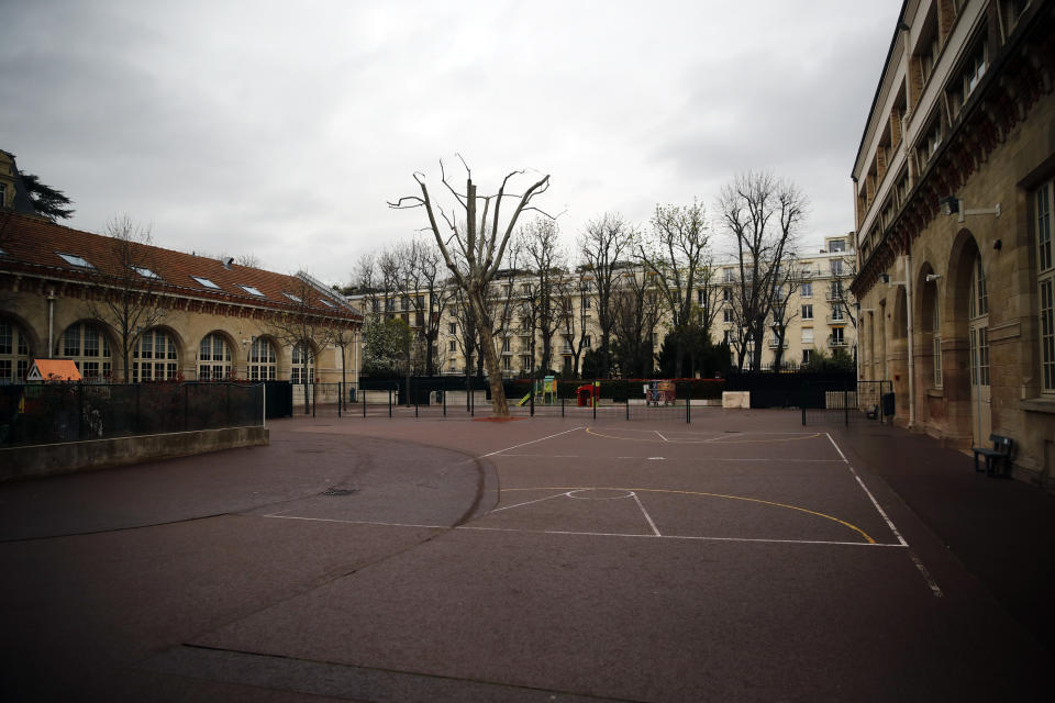 The schoolyard of Achille Peretti school is pictured in Neuilly-sur-Seine outside Paris, Saturday, March 14, 2020. France plans to close all creches, schools and universities from Monday until further notice to limit the spread of the novel coronavirus, President Emmanuel Macron says. For most people, the new coronavirus causes only mild or moderate symptoms. For some it can cause more severe illness, especially in older adults and people with existing health problems. (AP Photo/Christophe Ena)