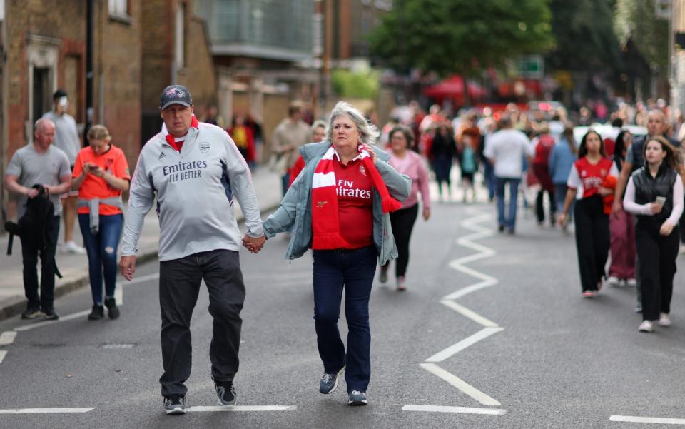 Arsenal fans make their way to the stadium prior to the FA Women's Super League match between Arsenal and Tottenham Hotspur at Emirates Stadium  - The FA Collection